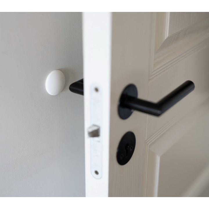 Veggmontert dørstopper